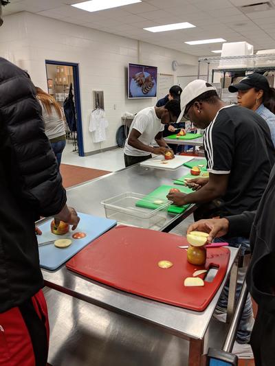 Foods students creating apple swans
