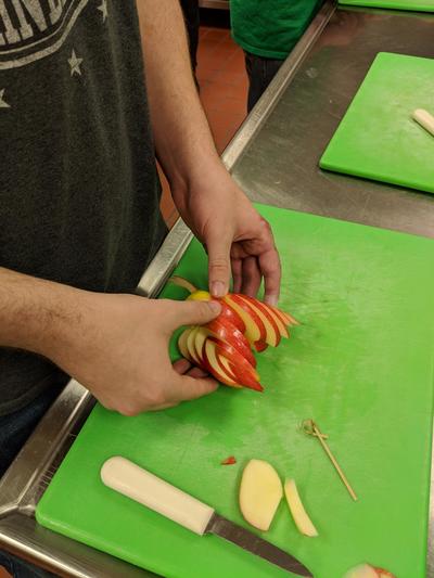 Student working on their apple swan
