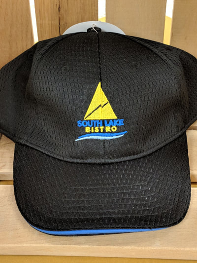 Black hat with South Lake Bistro imprinted on it