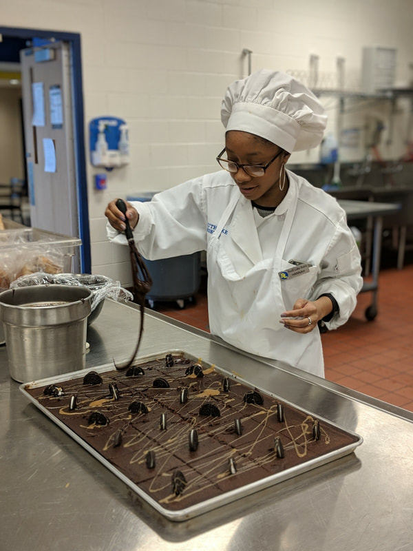 student making brownies