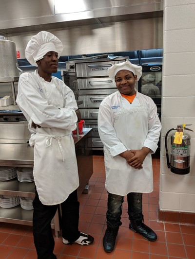 Two male Culinary Arts students posing for picture