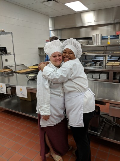 Two female Culinary Arts students posing for picture