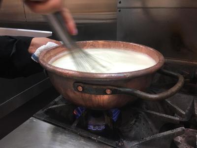 Chef's mom's copper pot being used on the stove.