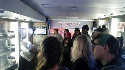 Students viewing presentation inside the Dexter Knives truck. 