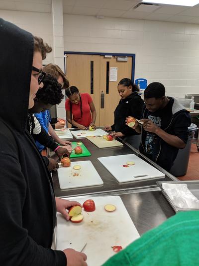 Foods students creating apple swans