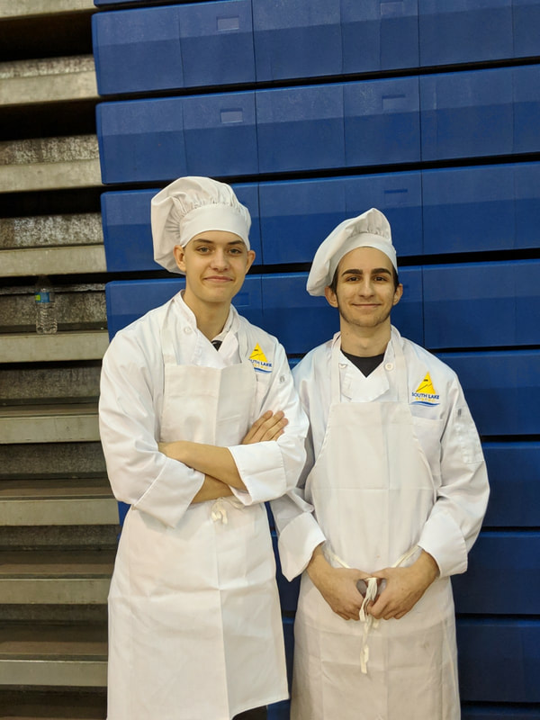 two students chefs posing for a picture