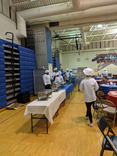Student chefs preparing to serve Jefferson Middle School students. 