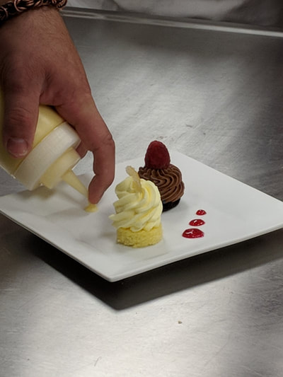 Chef decorating mousse duo.
