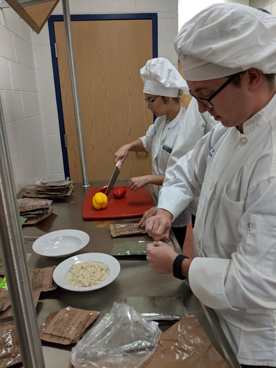 Students creating their new meals.