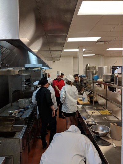 students cooking at ovens.
