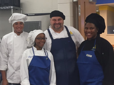 chef posing with students