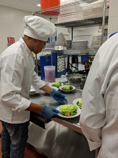student chef creating salad