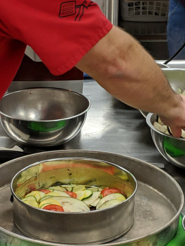 Chef creating ratatouille via a demonstration