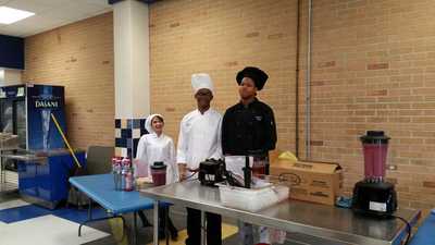 Picture of three culinary arts student chefs who were preparing the Berry Blast smoothies.