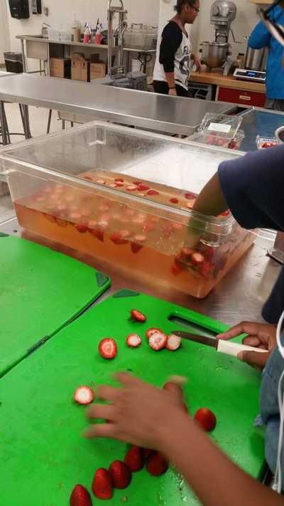 Strawberries being sanitized.