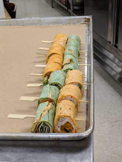 appetizers of rolled sandwiches on a skewer