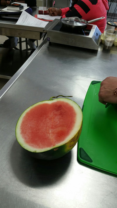 Black watermelon cut in half